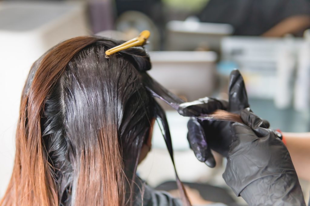 Hair coloring in a beauty salon, Asian women hair coloring in beauty salon.